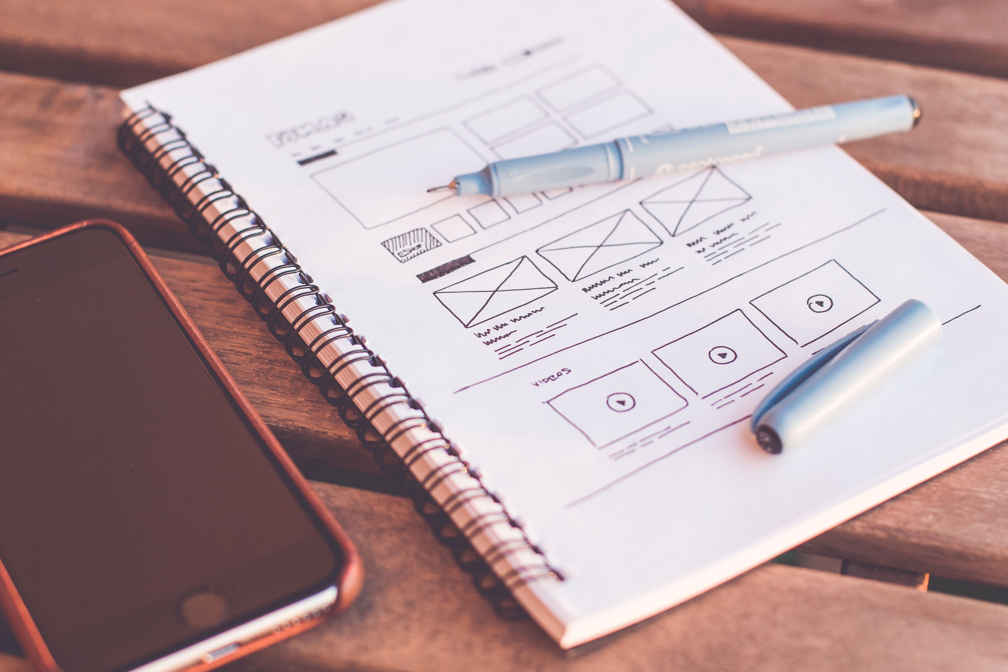 Creative studio workspace with printed layouts