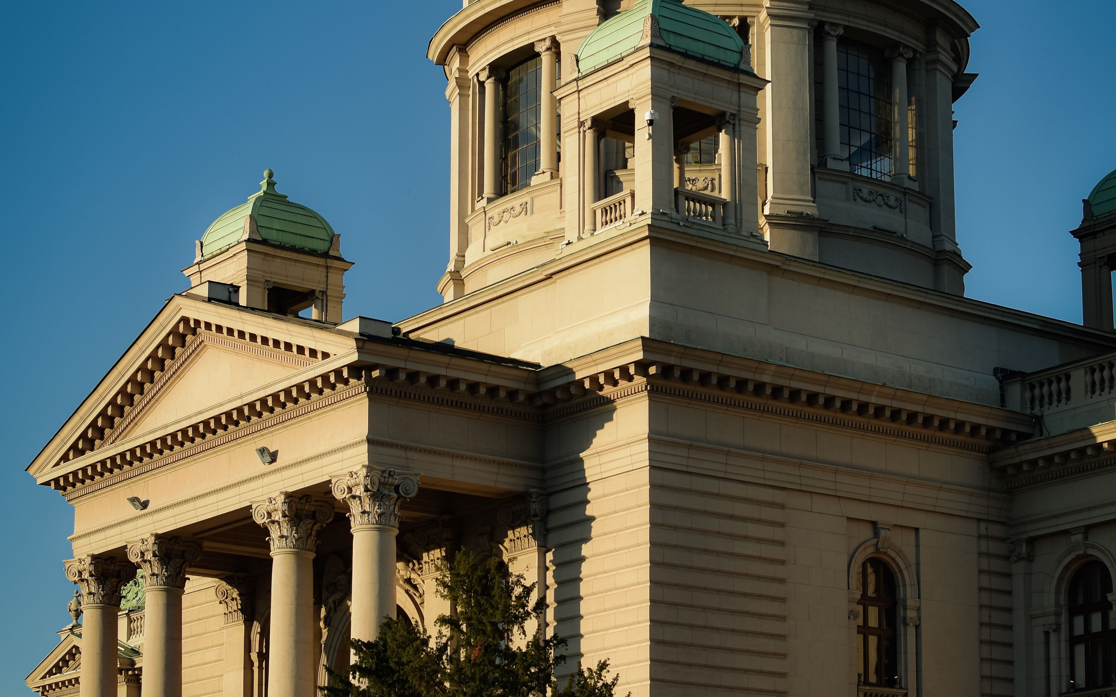 Neoclassical government building with columns and a domed roof